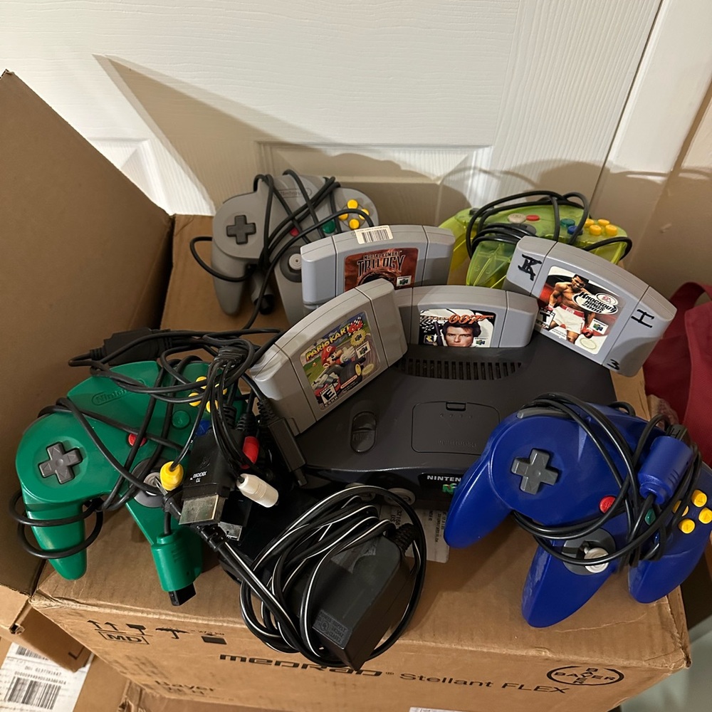Nintendo 64 Console with Blue and Green Controllers